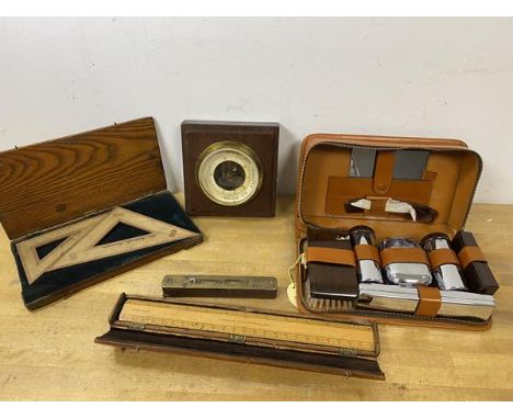 A mixed lot including a travelling toiletry set which measures 7cm x 25cm x 14cm, also a ruler with case, level, barometer an