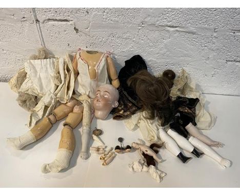 A German Dressel bisque head doll, model number 1349, size 8, head heavily damaged and partly restored with jointed compositi