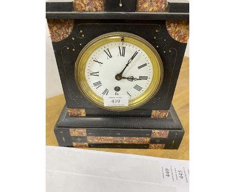 A late Victorian slate mantel clock of architectural form with marble segments, dial with roman numerals, measures 28cm x 23c