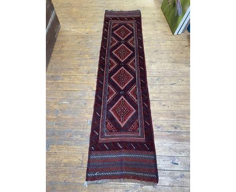 A Meshwani runner with four radiating diamond medallions, measures 250cm x 61cm