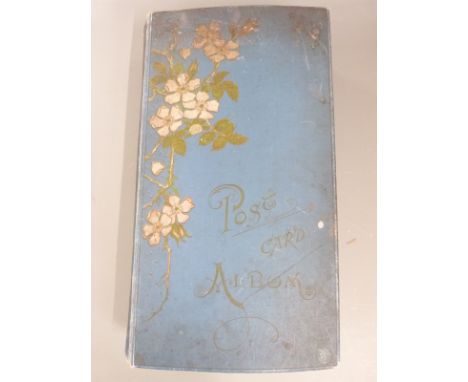 A large Edwardian postcard album containing approximately 450 cards, a wide range with topographical including Wales - Holyhe