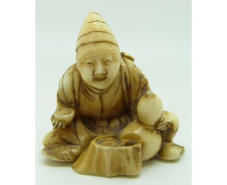 Japanese Meiji period signed ivory netsuke of a seated man with double gourd water bottle, H5.5cm&nbsp;