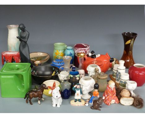 A collection of novelty ceramics and collectables including Carltonware Red Baron teapot, Guinness figure, guardsman napkin r