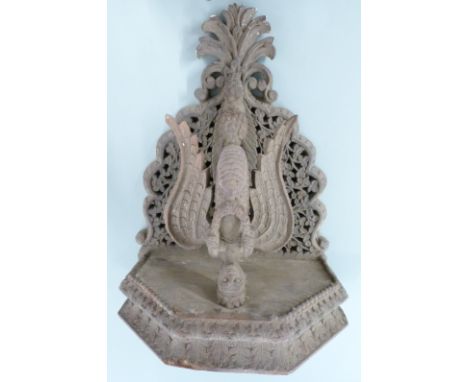 Nepalese/ Anglo Indian carved figural shelf bracket with fretwork decoration, the central figure the Hindu deity Garuda holdi