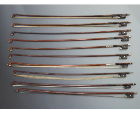 Ten round stick violin bows with various button types, plain eyes to frogs