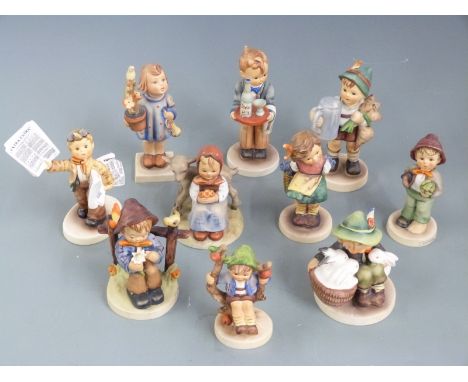 A collection of Goebel Hummel figures including Newspaper Vendor, tallest 14cm