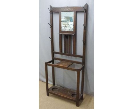 An oak hall stand with mirror and umbrella / stick wells, W76 x D25 x H187cm&nbsp;