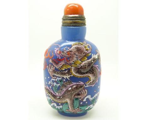 Chinese glass scent bottle with raised enamel dragon decoration and four character mark to base, with coral stopper, 8cm tall
