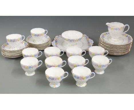 A collection of Foley teaware decorated with flowers, pattern number 1435, comprising twelve trios plus cake plates, jug and 