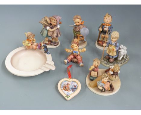 A collection of Goebel Hummel figures, pin tray, tableau etc, tallest 14cm&nbsp;