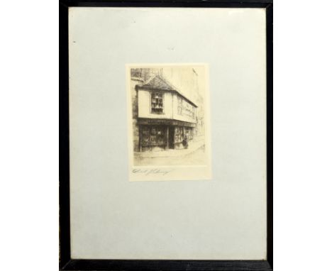 Edward J Cherry, (1886-1960), Figure by a shop window, black and white etching, signed in pencil to lower left margin, 13 x 9