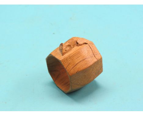 A Robert 'Mouseman' Thompson napkin ring, light oak with carved signature mouse