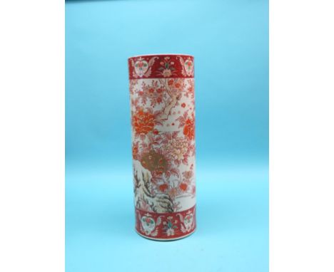 A Kutani cylindrical earthenware stick-stand, brightly painted with flowering shrubs, 25in. - cracked