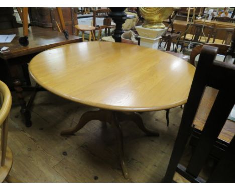 An Ercol light elm draw-leaf dining table, oval with concealed extra leaf, 3ft. 8in. - clean