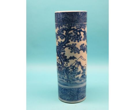 A Chinese cylindrical porcelain stick-stand, painted with playful youths within garden setting in underglaze blue, 24in.