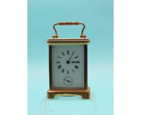 An early 20th century brass carriage clock, enamelled dial with alarum, timepiece movement, 5.75in.