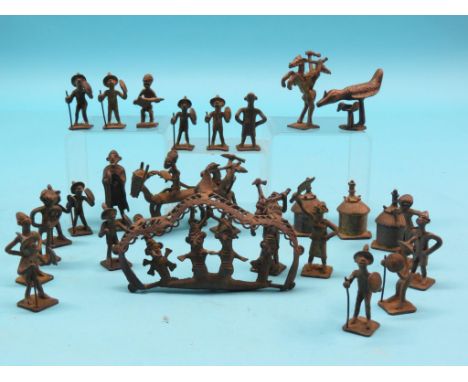 An African rough-cast village, 22 figures at various manual pursuits, and five related items 