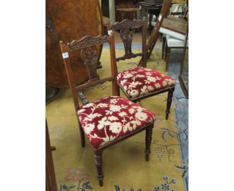 A set of four late Victorian carved walnut dining chairs, with upholstered seats, together with a carved octagonal oak occasi