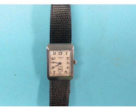 A gentleman's engine-turned silver wristwatch, champleve dial signed J. W. Benson, London, with subsidiary seconds, Swiss sho