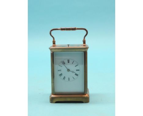 An early 20th century French brass hour-repeating carriage clock, enamelled dial with Breguet hands, movement striking on a g