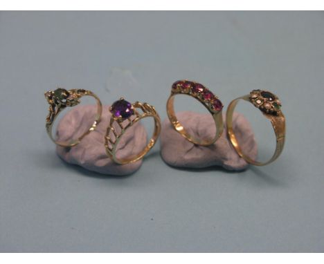 A 14ct. gold ruby half-hoop ring, 18ct. gold ring set coloured cluster, and two 14ct. gold dress rings