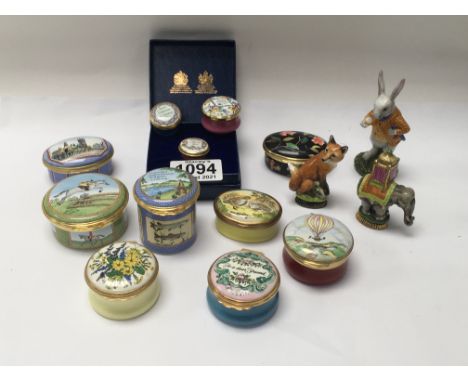 A collection of Halcyon Days, Bilston enamel and Crummle enamel pill boxes Including 2 silver mounted animal figures.