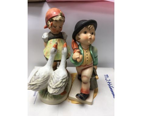 A collection of seven Goebel/ Hummel figures and two royal Doulton figures.
