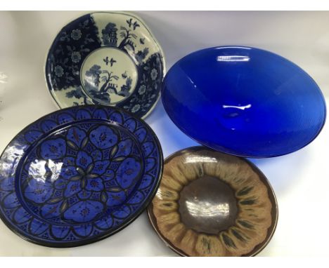 Three large ceramic dishes, largest approx 35cm in width plus a large modern blue glass dish (4).