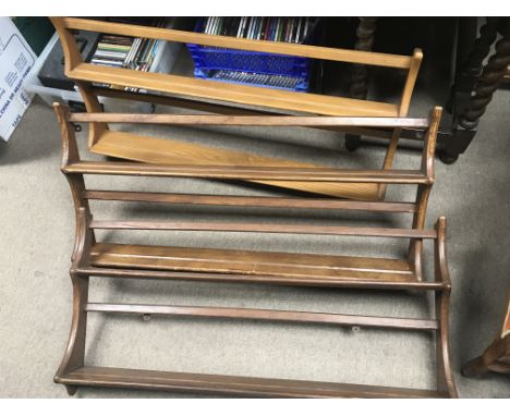 Three Ercol plate racks, measuring approximately in length 96cm and in height approximately 50cm.