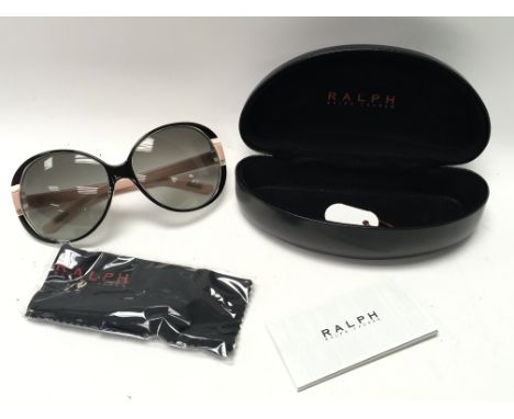 A pair of Ralph Lauren sunglasses in their original case. Including manufacturers leaflet and cleaning cloth which is as new.
