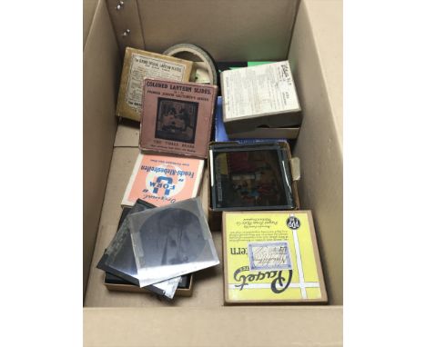 A box containing a quantity of vintage magic lantern slides. No reserve.