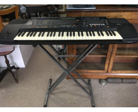 A 1993 Roland E86 keyboard with stand, manual and power lead - NO RESERVE