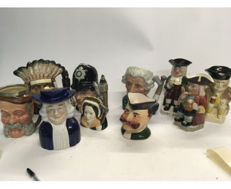 Three large Royal Doulton character jugs and other ceramic medium sized character jugs and Toby type jugs (a lot) - NO RESERV