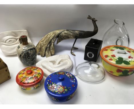 A collection of oddments including: a large carved horn peacock, Japanese enamel cooking pots, a boxed browny camera, two pie