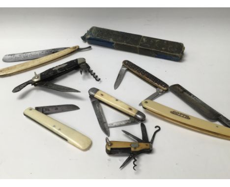 Five vintage pocket knives. One is Saynor, T Turner and C Small. There is a George Wostenholm multi tooled knife and two razo