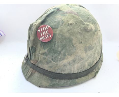 A Vietnam War Era U.S. M1 Helmet And Cover.