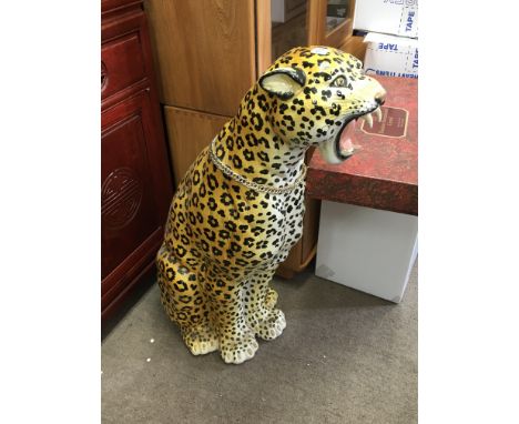 A large ceramic model of leopard.