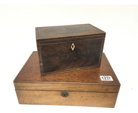 A George III mahogany and boxed inlay tea caddy with a hinged top enclosing two compartments and a mahogany writing box (2)