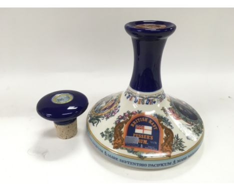 A ceramic bottle of Pusser's British navy rum, the bottle decorated with images of Nelson and Brittania.