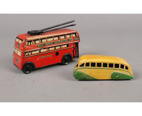 A vintage tin plate Wells Brimtoy trolley bus AWW 516, to include a Dinky Meccano die cast bus  