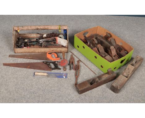 A large vintage open tool box with various tools, together with a box of five large wood planes with spare pieces etc. Tool b