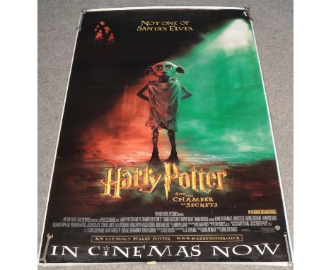 A large Harry Potter and the Chamber of Secrets film poster. (181cm x 120cm)  Tear to top right of the poster.