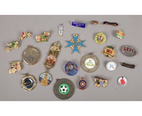 A box of badges to include Egyptian enamel example etc.  