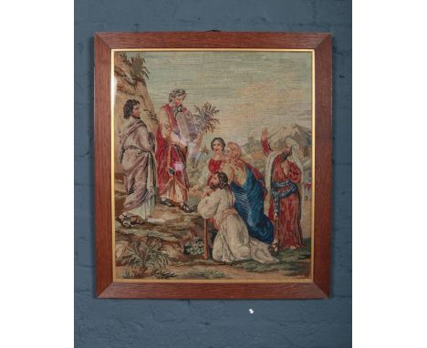 A large needlepoint tapestry, depicting a religious scene. (Framed and glazed). H- 71cm, W-60cm.  Condition good.