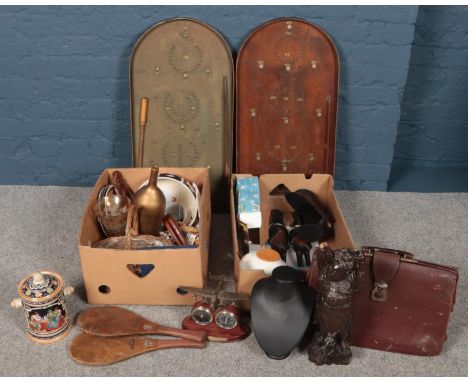 Two boxes of miscellaneous to include leather carry bag stencilled M.L.H, Jokari bats, carved figures, west Germany biscuit b