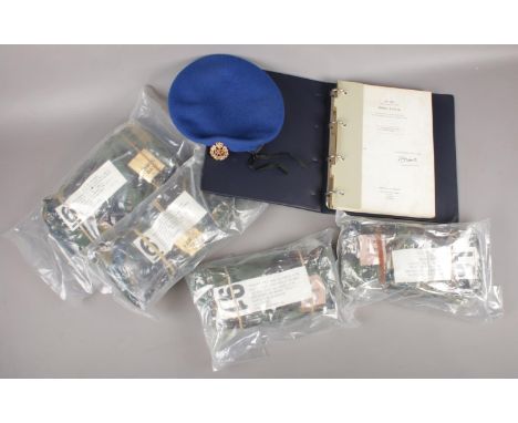 A box of militaria to include diving manual, RAF cap, protective smock and trousers.  
