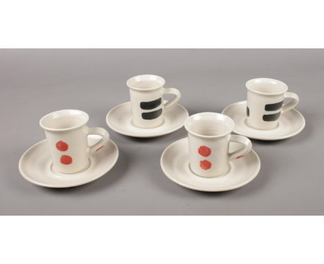 Four Ann McNulty pottery coffee cups and saucers.  