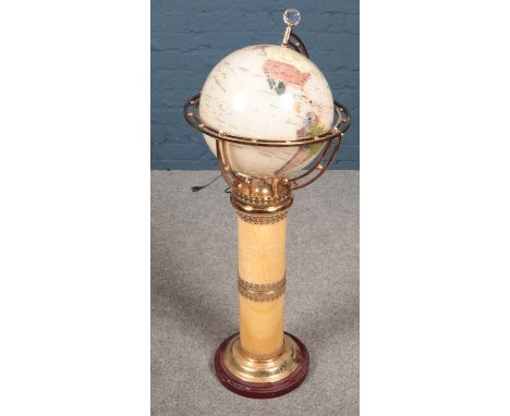A light up globe on centre pedestal support.  