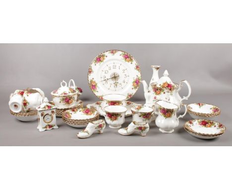 A quantity of Royal Albert old country roses tea/dinnerwares to include clock plate, cups &amp; saucers, small clock, vases, 