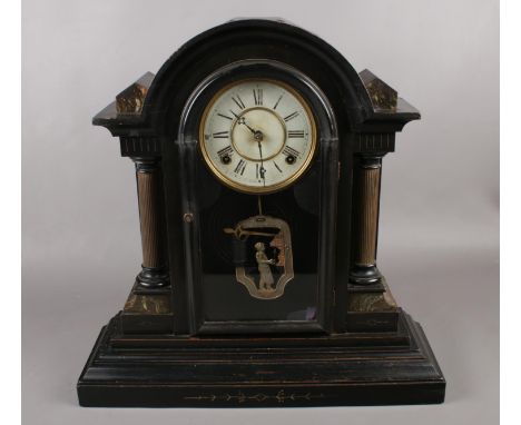 A large painted mantel clock with column supports and figural pendulum.  Good condition.